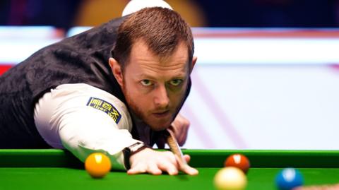 Mark Allen plays a shot