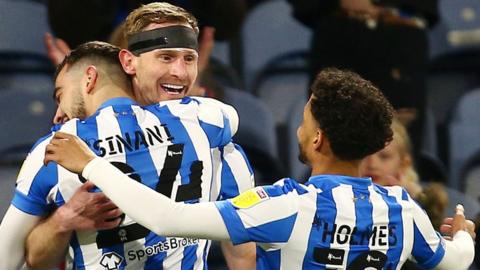 Huddersfield celebrate Tom Lees' first goal against Peterborough.