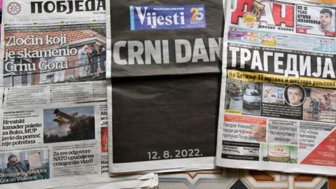 A picture shows the front pages of Montenegro's major newspapers the day after a mass shooting in the town of Cetinje, in Montenegro, on August 13, 2022. - At least 11 people were killed