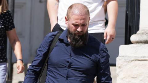 Adam Reid pictured arriving at Lewes Crown Court in Lewes, East Sussex.