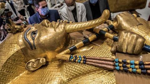 A close up of the face of the Golden Sarcophagus of Tutankhamun.
