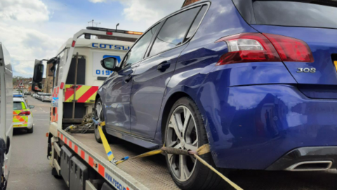 Car being taken away by HGV