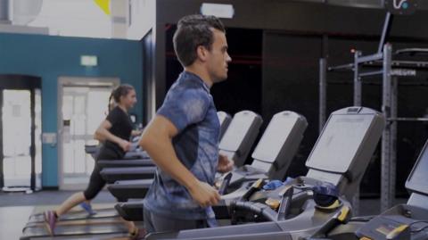 people exercising on treadmills