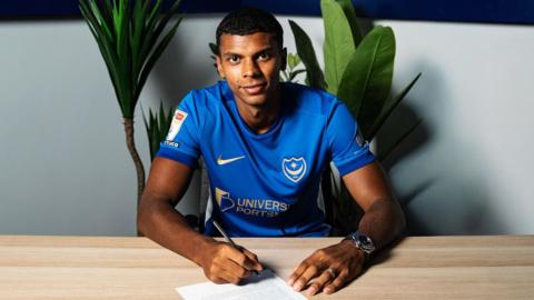 Iyad Mohamed poses for a photo after signing his Portsmouth contract
