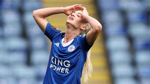 Alisha Lehmann holds her hands to her head in frustration