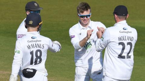 Hampshire celebrate taking a wicket against Gloucestershire