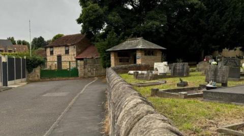 The road to the planned site next to the church