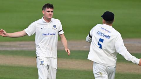 Jack Carson of Sussex celebrates with Henry Crocombe