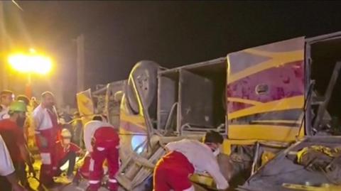 Emergency workers rescue collapsed bus after crash in Iran's Yazd province. Image provided from Irinn, Iranian news agency.