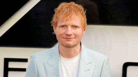 ed sheeran in a pale blue suit