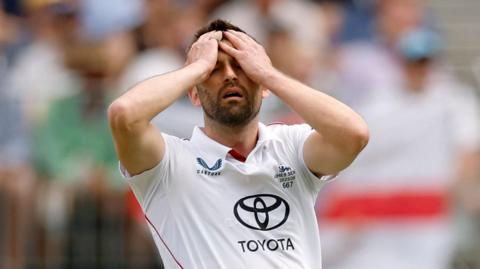 Mark Wood reacts during England's first Ashes Test in Perth