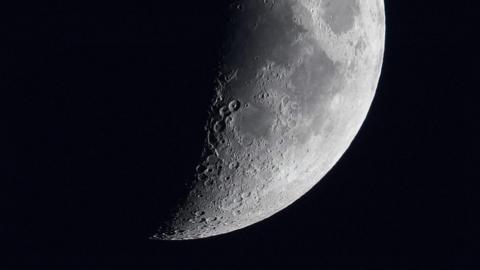 The Moon in part shadow, with craters showing