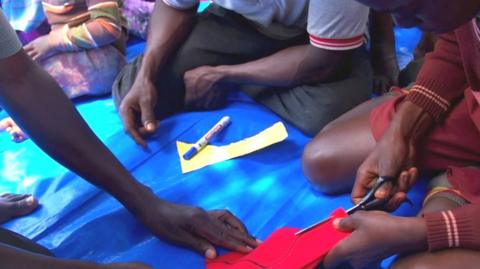 Boys making recyclable sanitary pads