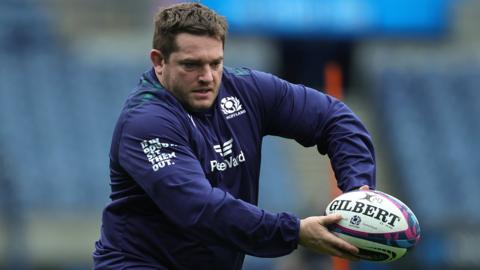 Elliot Millar Mills in action during warm-up for Scotland