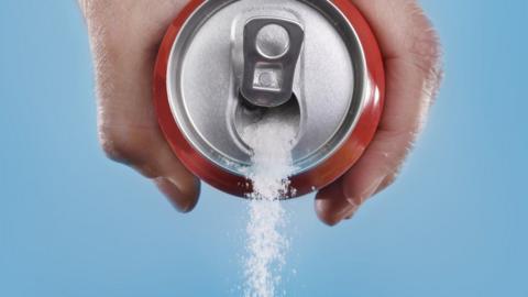 Sugar pouring out a can