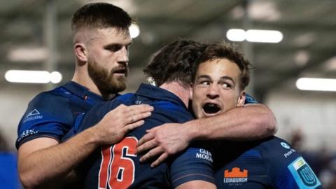 Edinburgh celebrate scoring a try against Lions