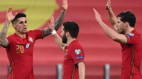 Portugal celebrate their opening goal