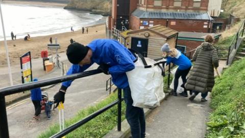 Litter pickers at Cullercoats