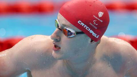 Jordan Catchpole looks to his right in a swimming pool