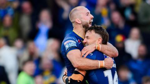 Leeds' Chris Hankinson is congratulated by Jarrod O'Connor on scoring a try against St Helens