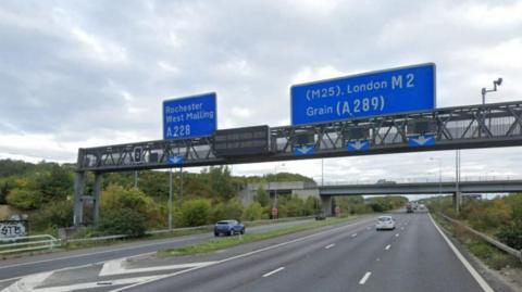 Junction two of the M2 with signs over the motorway saying Rochester and West Malling, and London and Grain