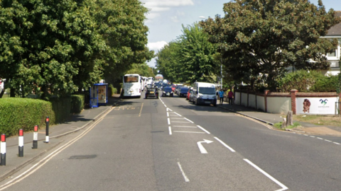 A Google Street image of a section of the A259 in Eastbourne that could be impacted. There are a lot of vehicles on the road and a blue bus stop on the left.