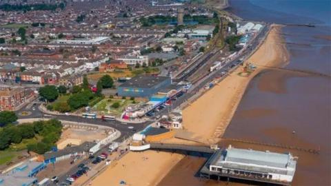 An aerial view of Cleethorpes beach showing the pier in the foreground 