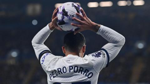 Pedro Porro takes a throw in