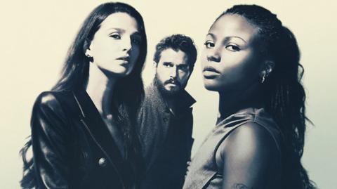 Three people looking at the camera