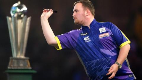 Luke Littler in action in the final of the World Darts Championship at Alexandra Palace