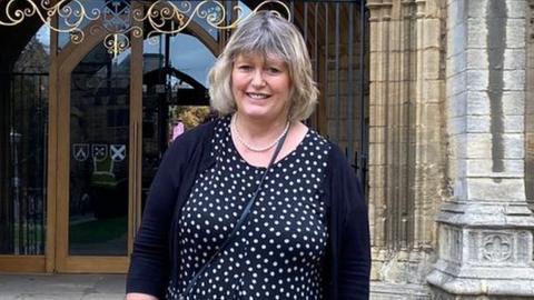 Julie Tate in front of the cathedral