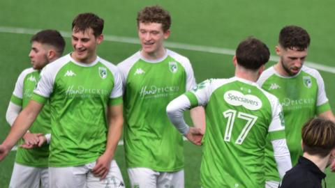 Guernsey FC players celebrate beating Lingfield