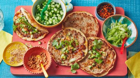 A spread of Pork smash tacos