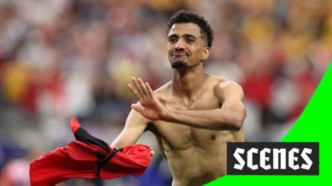 Hossam Abdelmaguid rips his shirt off after scoring the winning penalty for Egypt against Australia in the 2026 World Cup.