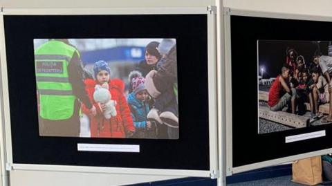 Images of child refugees on an exhibition board at the Isle of Man Airport