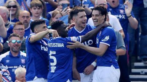 Ipswich players celebrate George Hirst's opening goal against QPR