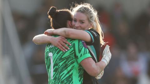 Gemma Bonner of Liverpool embraces team-mate Rachael Laws after their FA Cup win over Arsenal