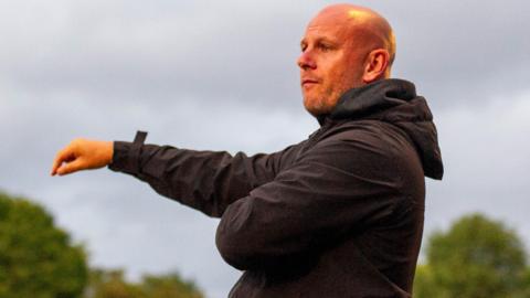 Adam Murray points out instructions while in charge of Kidderminster Harriers