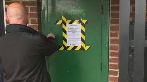 Signs being put up at Headlam Court in Tilery, Stockton