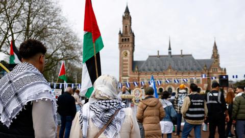 Demonstrators with Palestinian and Nicaraguan flags gather outside the International Court of Justice (ICJ) in The Hague on 8 April