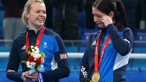 GB skip Eve Muirhead sheds a tear on the medal podium as team-mate Vicky Wright looks on