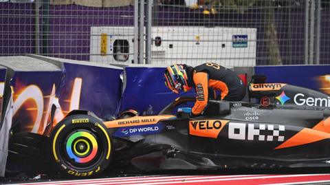 Oscar Piastri gets out of his McLaren after crashing out on the first lap of the Azerbaijan Grand Prix