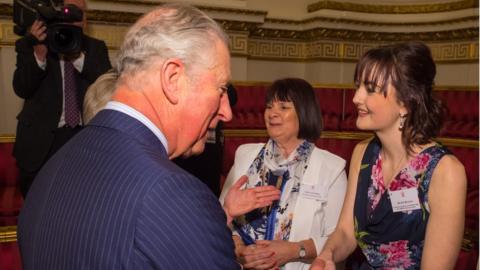The Prince of Wales meets Royal College of Nursing Student Nurse of the Year Zoe Butler (right) and Elaine Perry of Macmillan Cancer Support