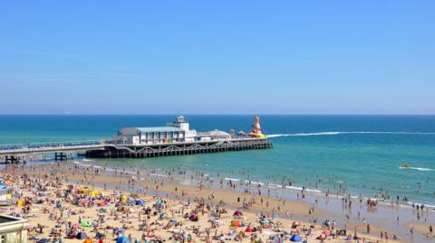 An aerial view of Bournemouth Pier on a clear summer's day.