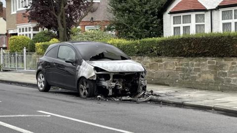 A burnt-out car