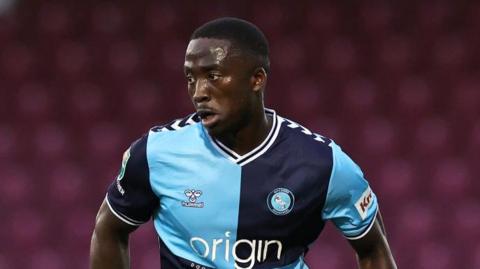 Salford City player Dan Udoh, puctured playing for Wycombe Wanderers.