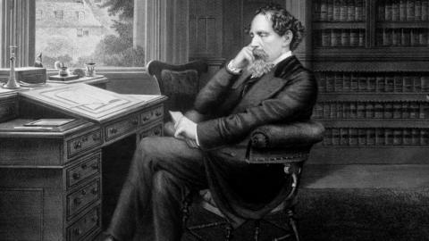 Charles Dickens in his study