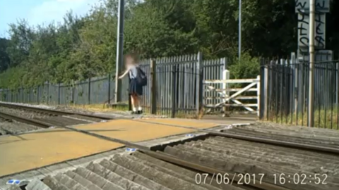 Child playing on railway tracks in St Albans