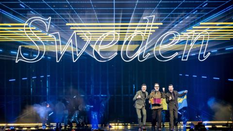 Sweden's KAJ take part in the flag parade during the dress rehearsal for the Grand Final of the 69th Eurovision Song Contest 