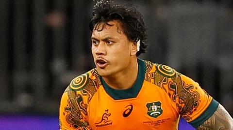 Len Ikitau playing for Australia